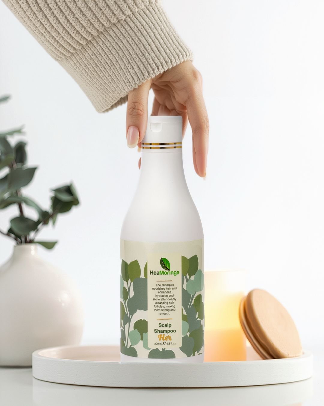 Maya and Tzvi with Moringa plants
